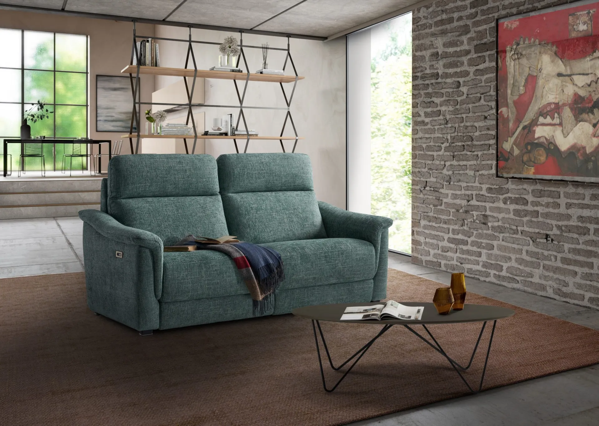 Divano relax Dandy Il Benessere verde salvia in un loft con mattoni