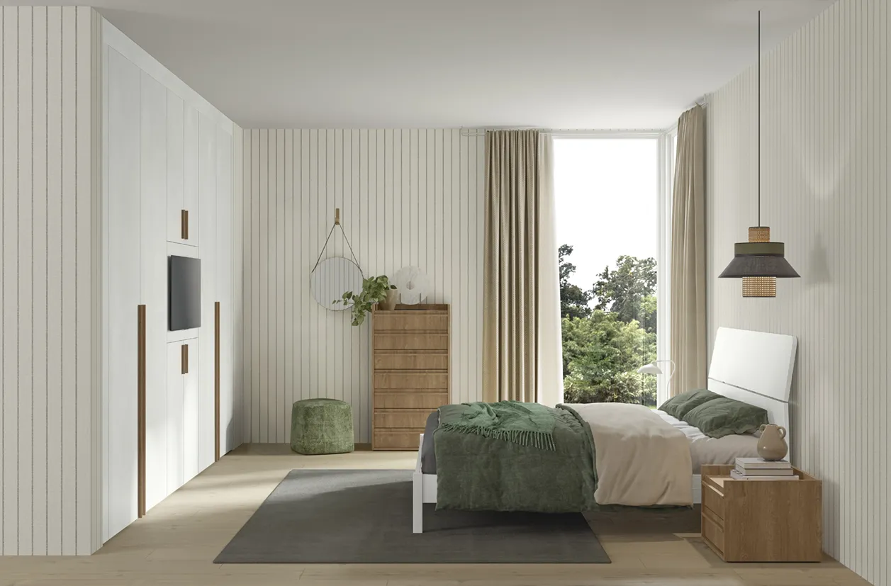 Letto Bent Colombini con testata bianca a taglio diagonale accanto a un settimino in legno