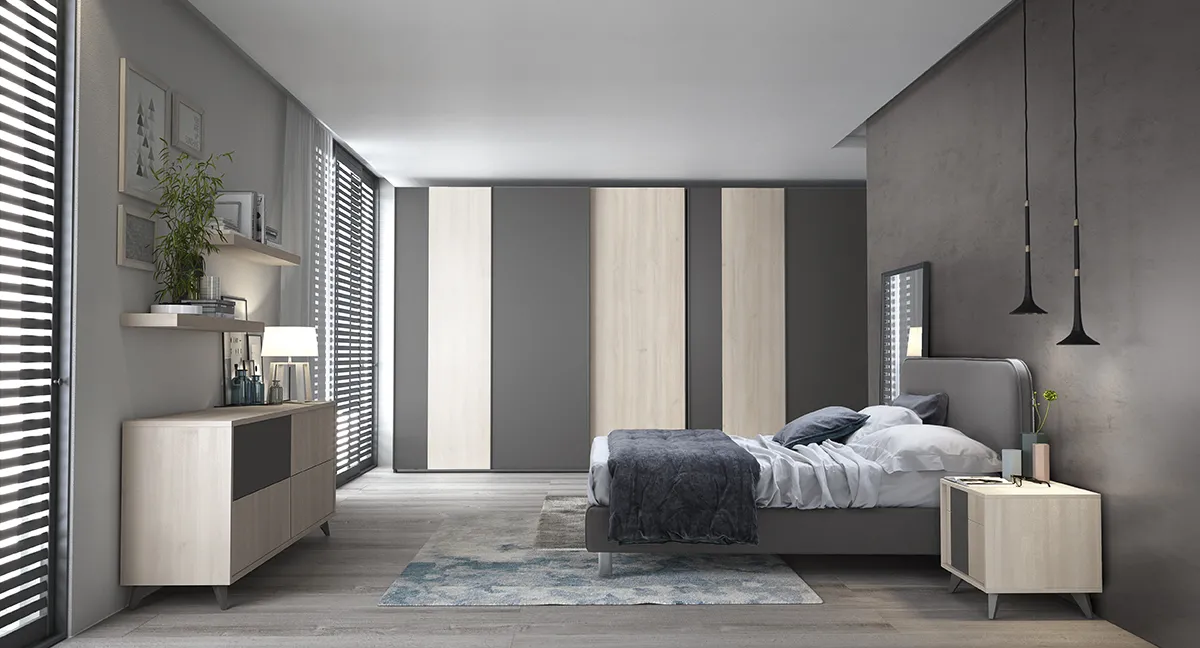 Letto Verso Colombini grigio in una camera con ante in legno e grigio scuro