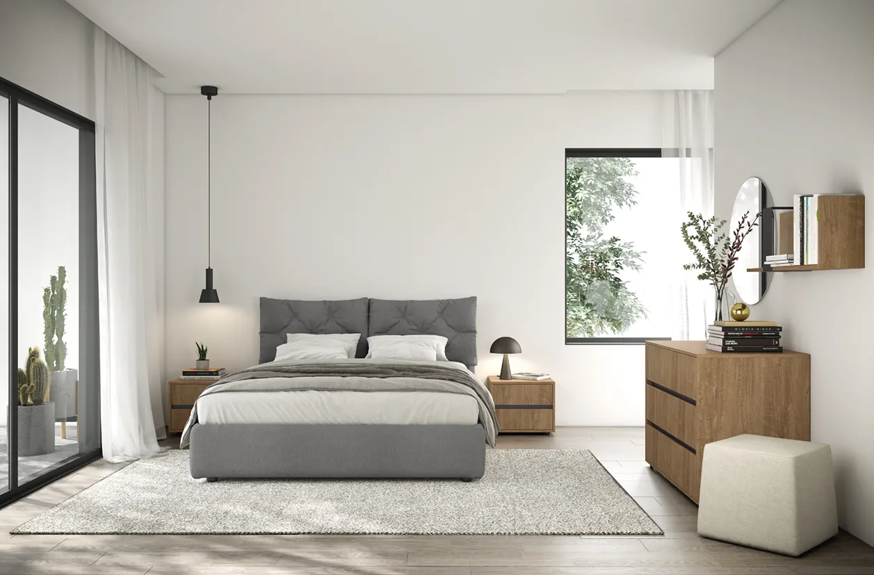 Letto imbottito Gallery Colombini grigio con cuscini trapuntati tra comodini e comò in legno chiaro