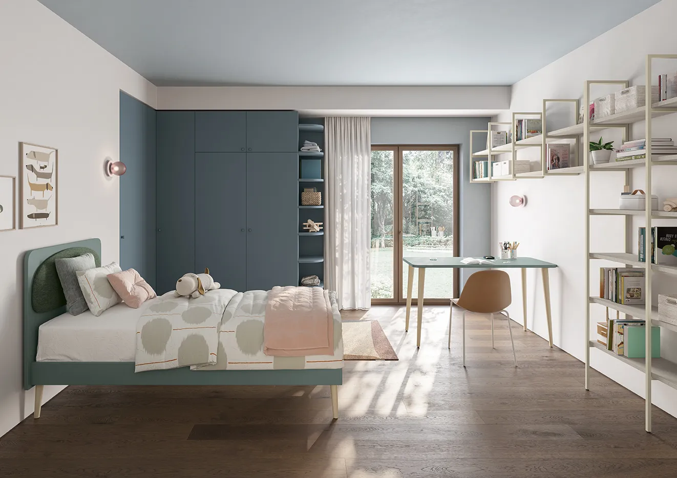 Letto Moonie Pad Colombini verde con cuscino rosa davanti a un armadio blu
