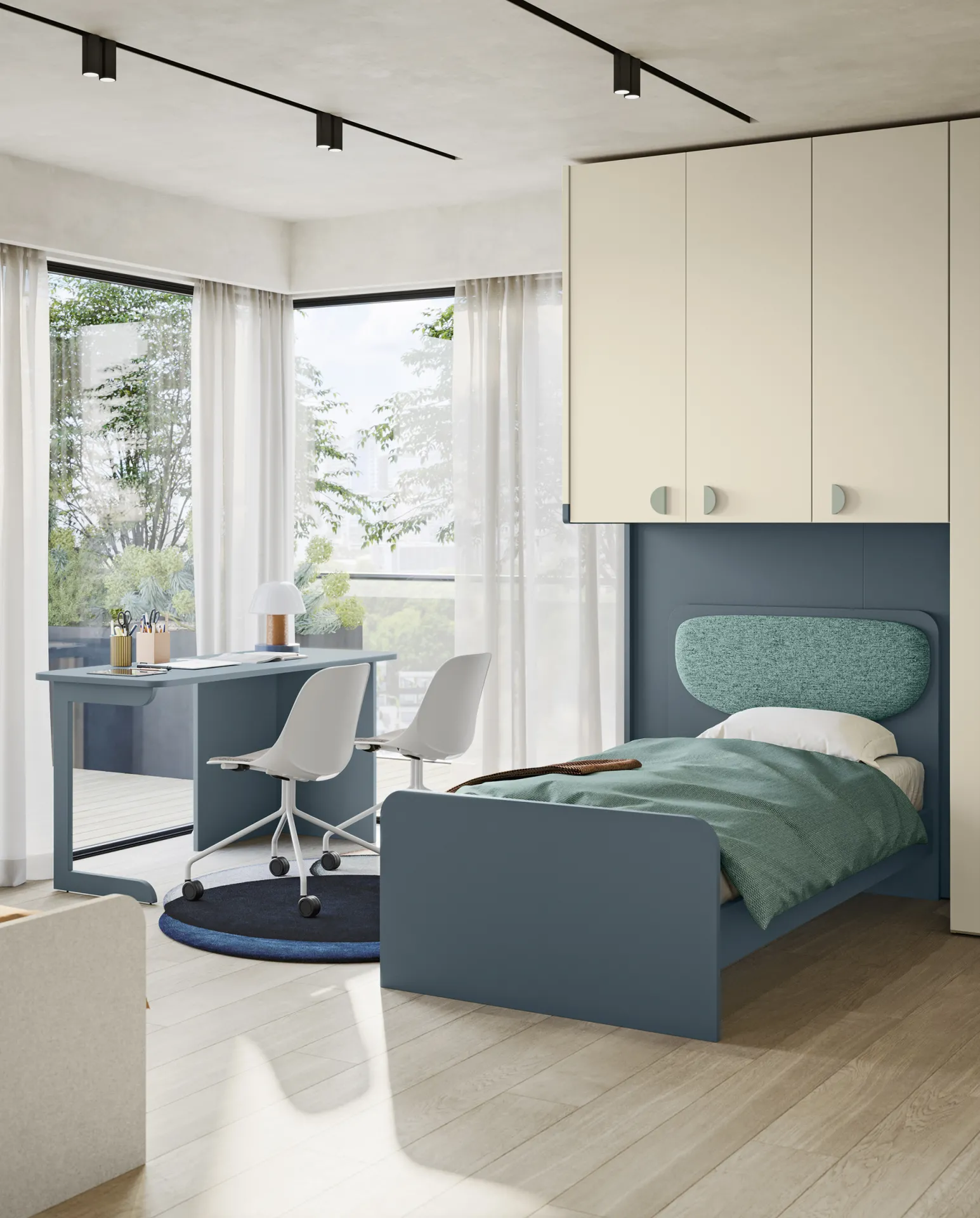Letto Moonie Pad Colombini blu con cuscino verde acqua sotto un ponte di pensili