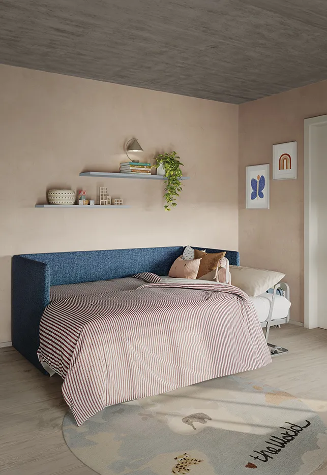 Divano letto Spazio Colombini blu notte con biancheria a righe rosa