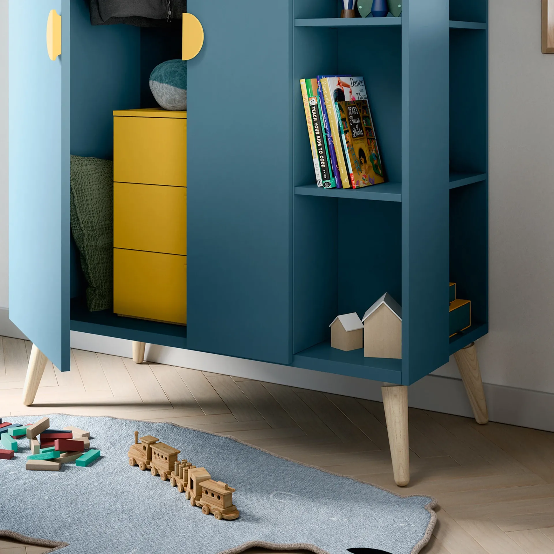 Armadio Woody Nidi aperto con cassetti gialli e libreria laterale