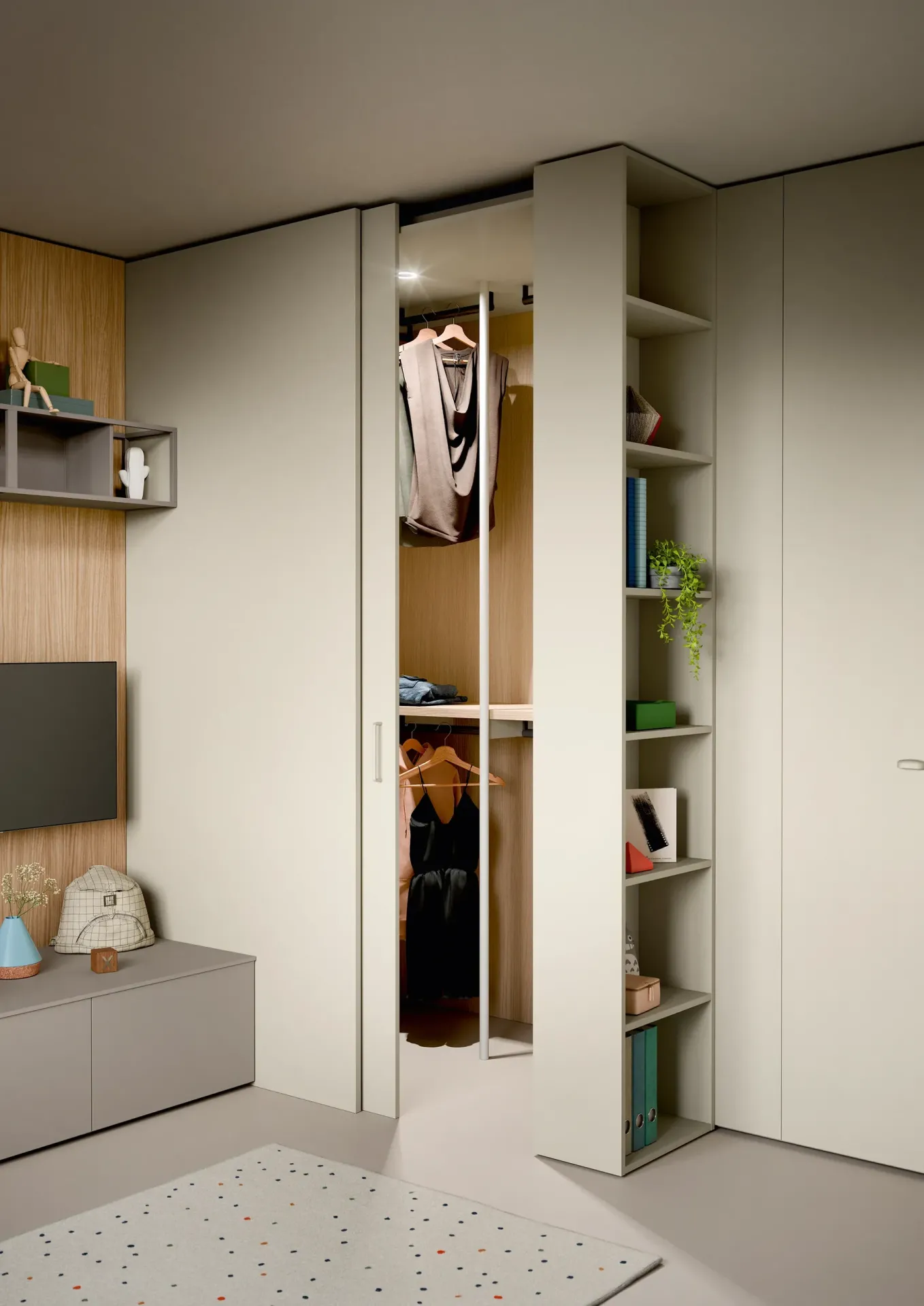 Cabina Cabì Nidi con anta aperta e abiti appesi all'interno
