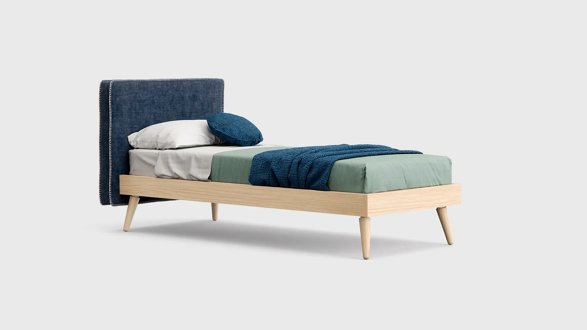 Letto Hug Nidi con testiera blu e gambe in legno scontornato