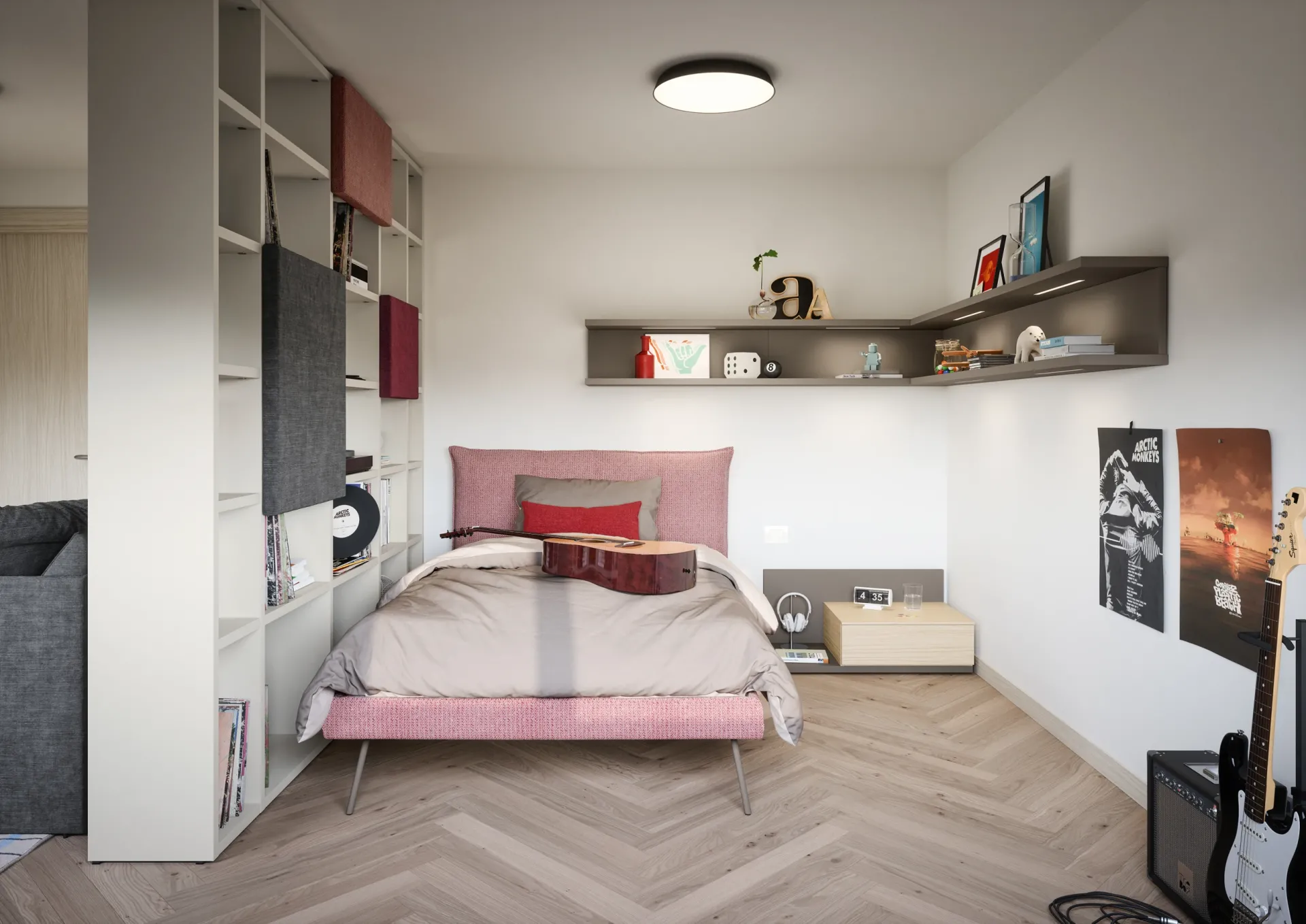 Letto Pillow Nidi rosa accanto a una libreria divisoria grigia
