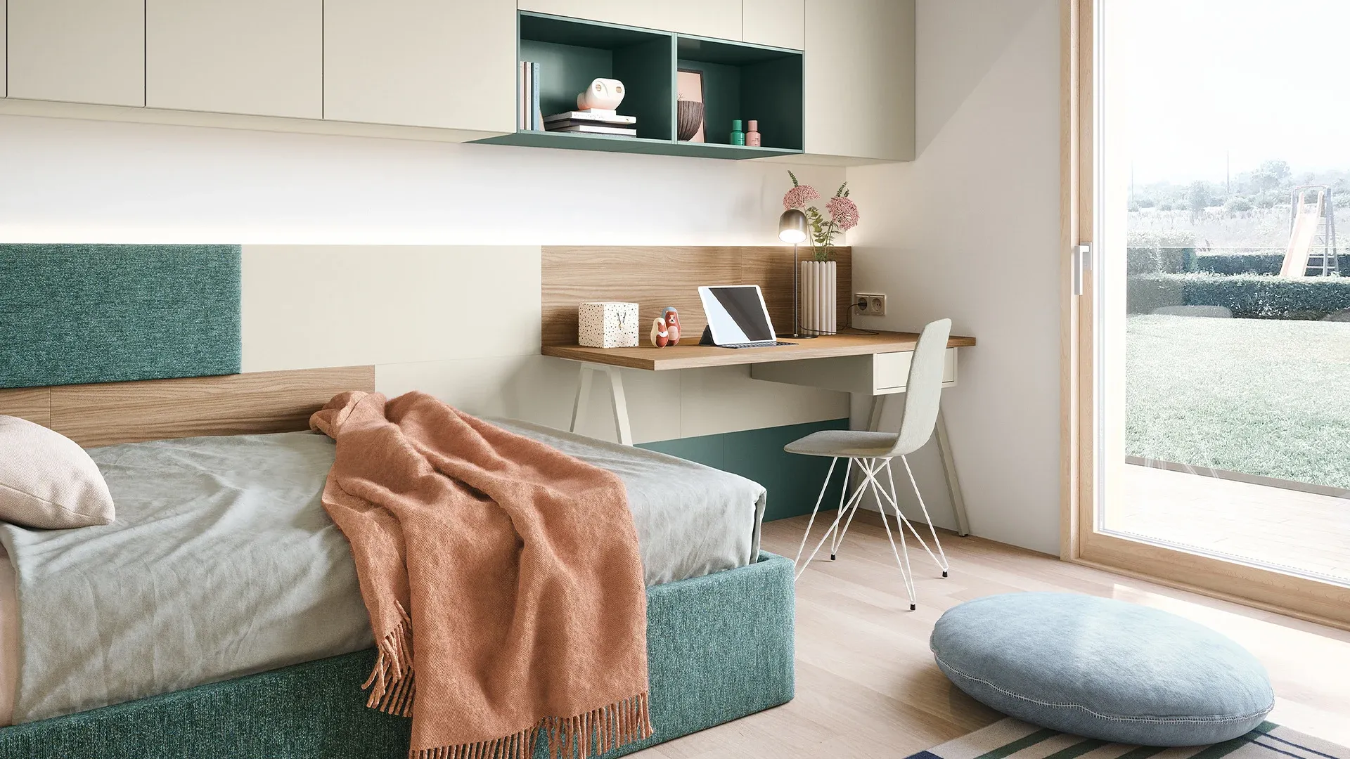 Scrivania Luce Nidi con cassetto e pensili verdi accanto al letto