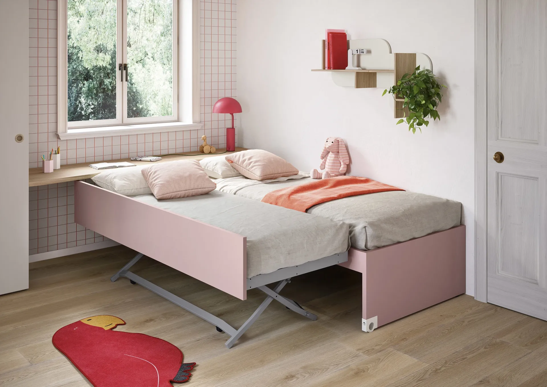 Cuscini Tinny Nidi sul letto rosa estraibile