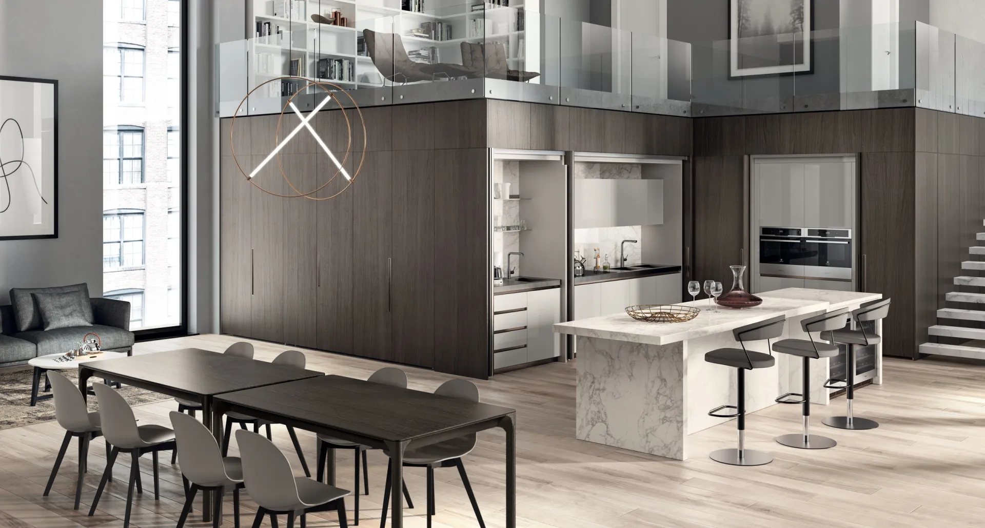 Cucina Boxi Scavolini in un loft, con isola dal piano effetto marmo davanti a un volume in legno scuro
