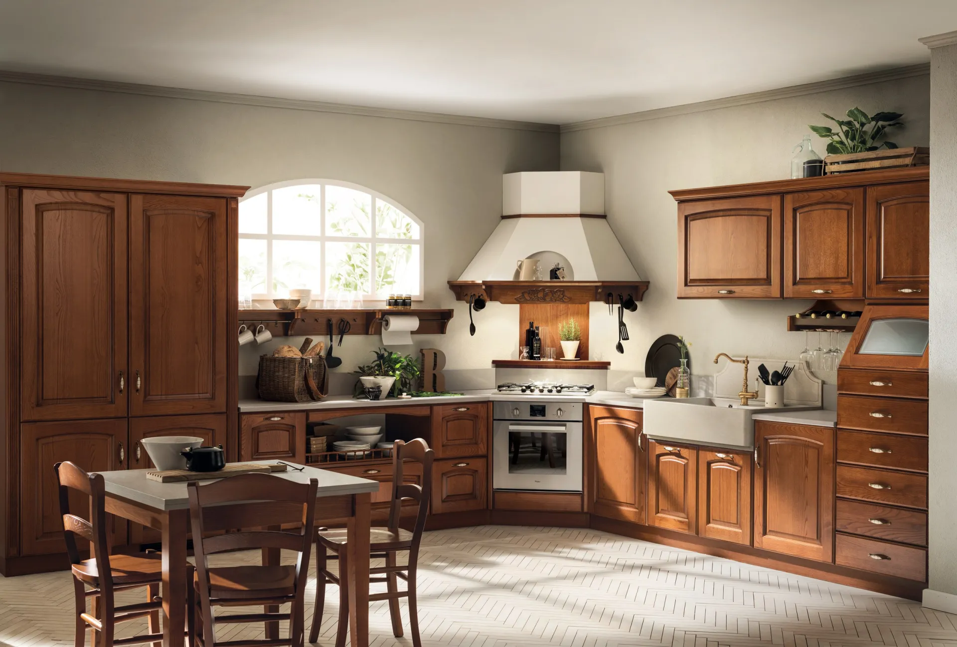 Cucina classica Madeleine Scavolini in Castagno ad angolo con cappa a camino e tavolo in legno