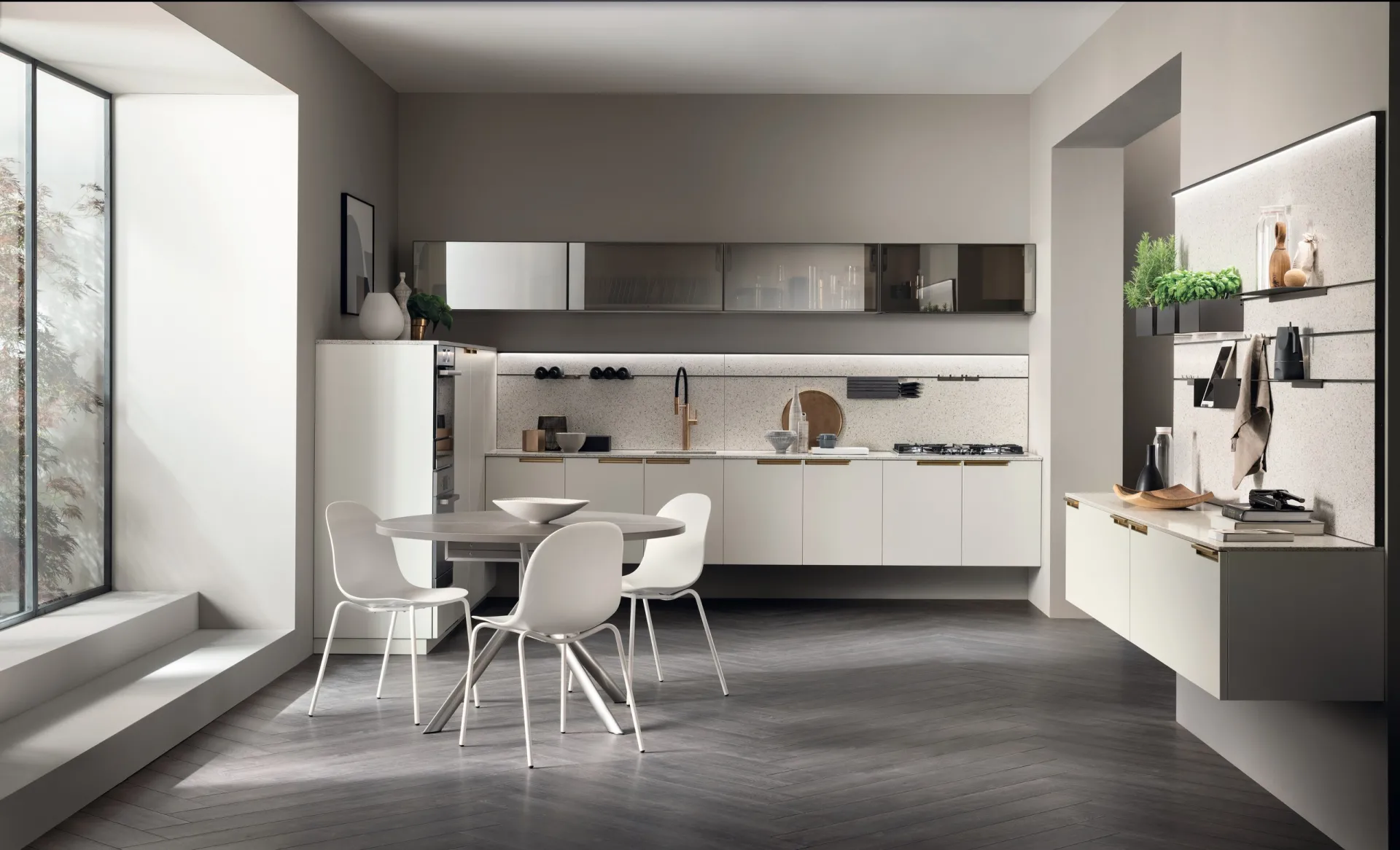 Cucina MIA by Carlo Cracco Scavolini sospesa in laccato opaco Bianco Prestige con tavolo rotondo