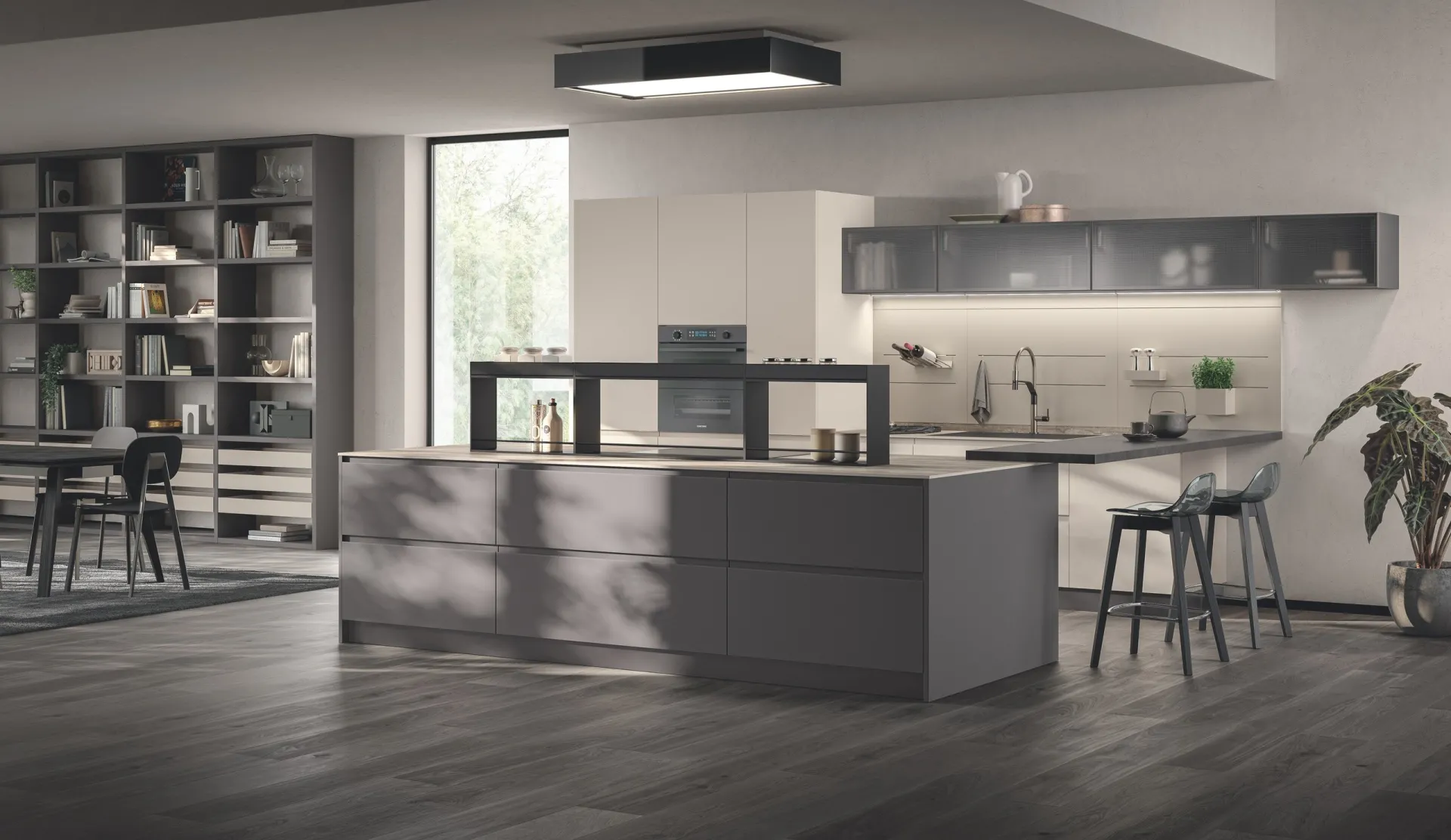 Cucina Motus Scavolini con isola in Grigio Ferro e libreria a giorno sullo sfondo