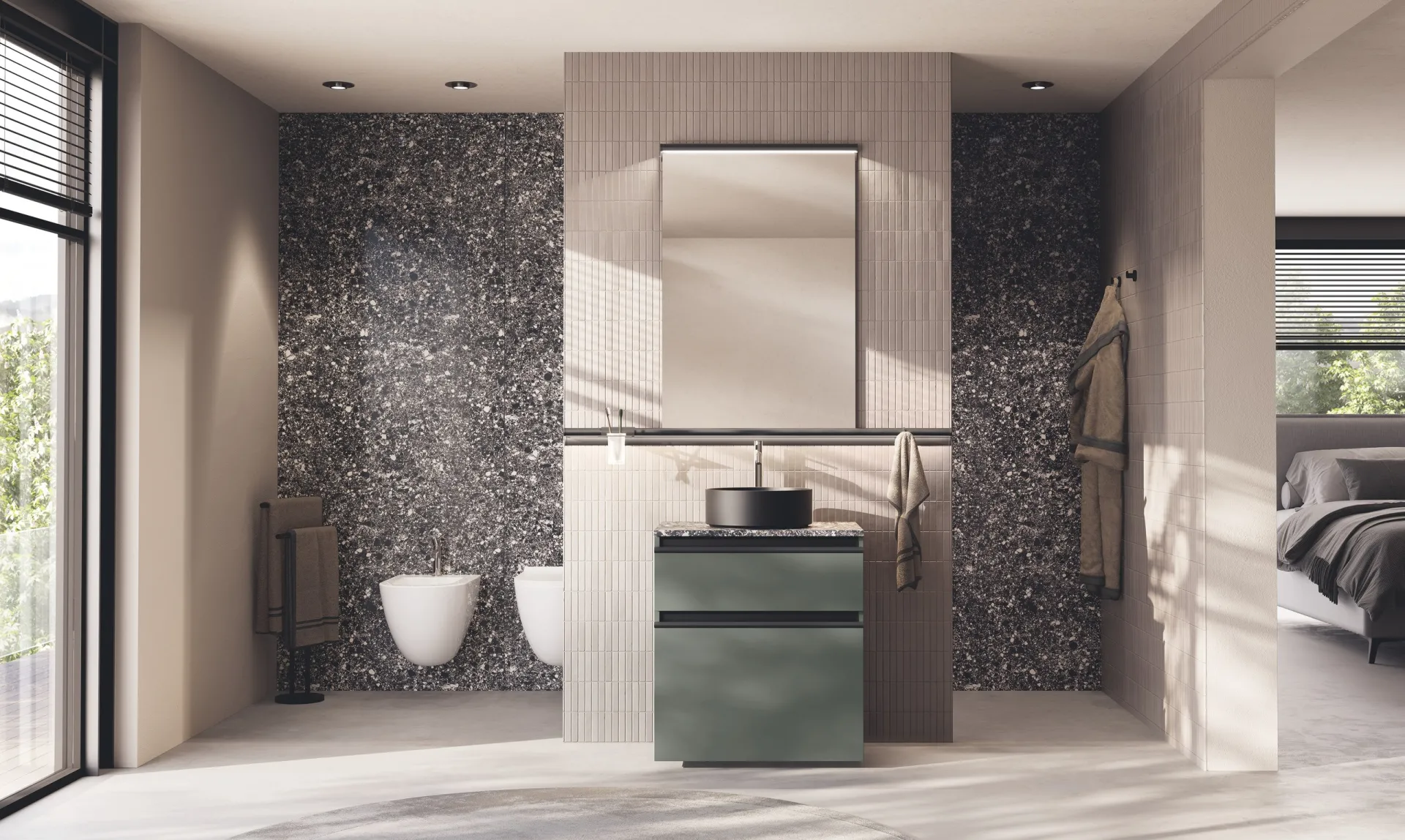 Bagno Stilo Scavolini con base verde scuro e lavabo nero in appoggio davanti a una parete in graniglia