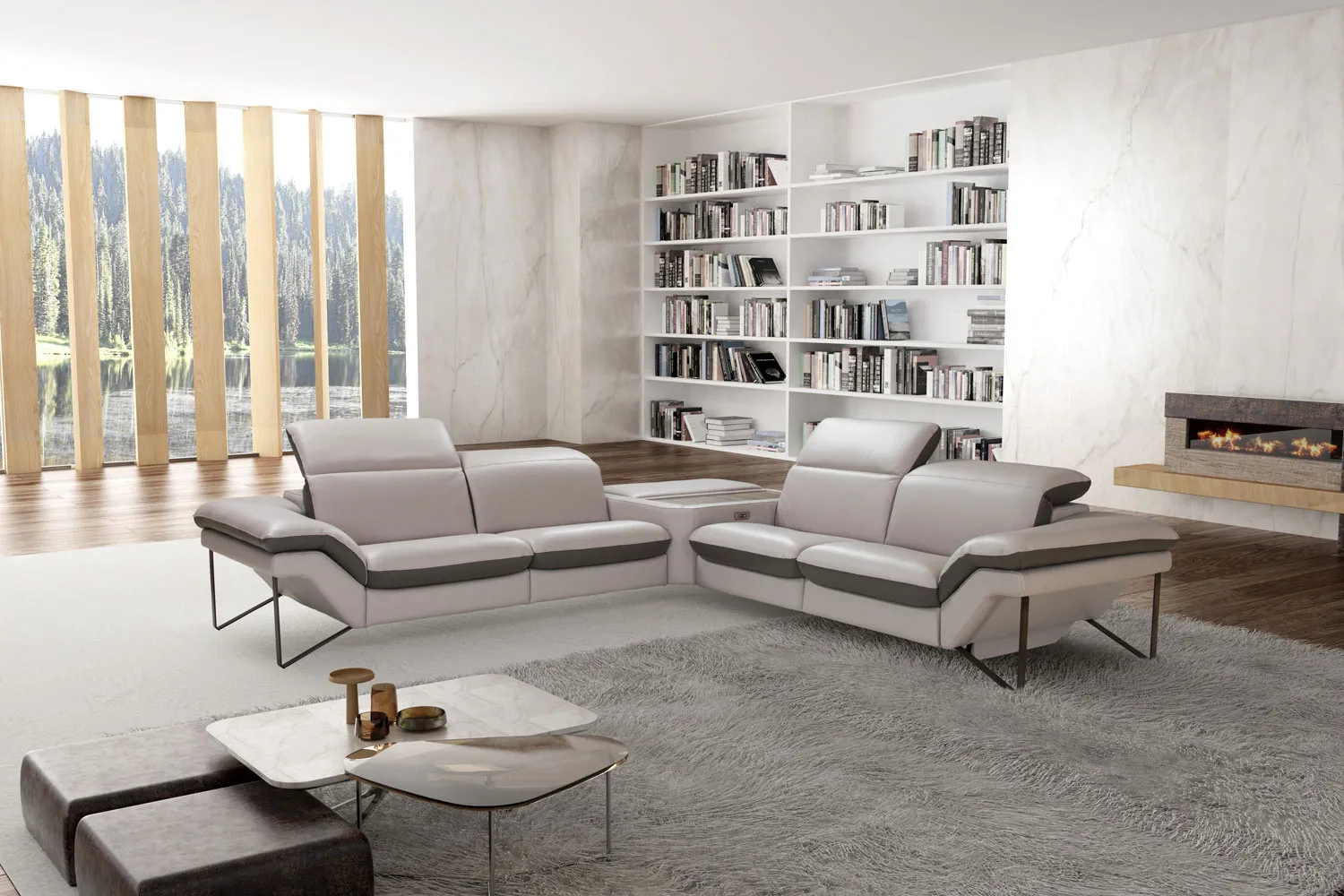 Due divani Kronos Max Sofà in pelle grigio chiaro in un soggiorno con libreria