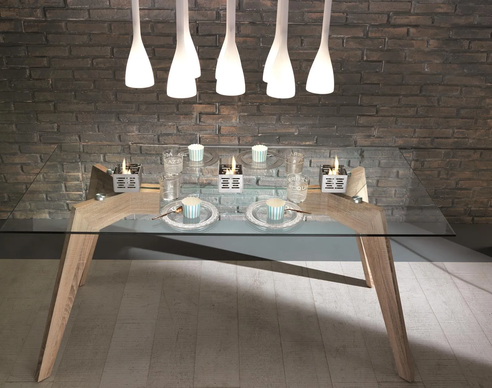 Biocamini Set Skato Stones su un tavolo in vetro e legno