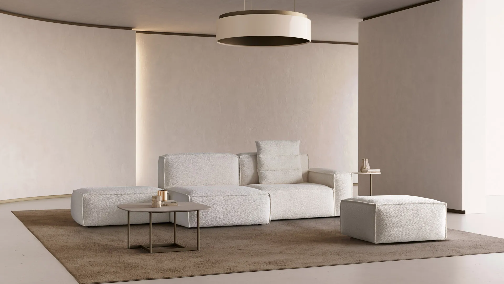 Divano Keira Aerre Divani bianco con penisola e pouf in un soggiorno chiaro con tappeto