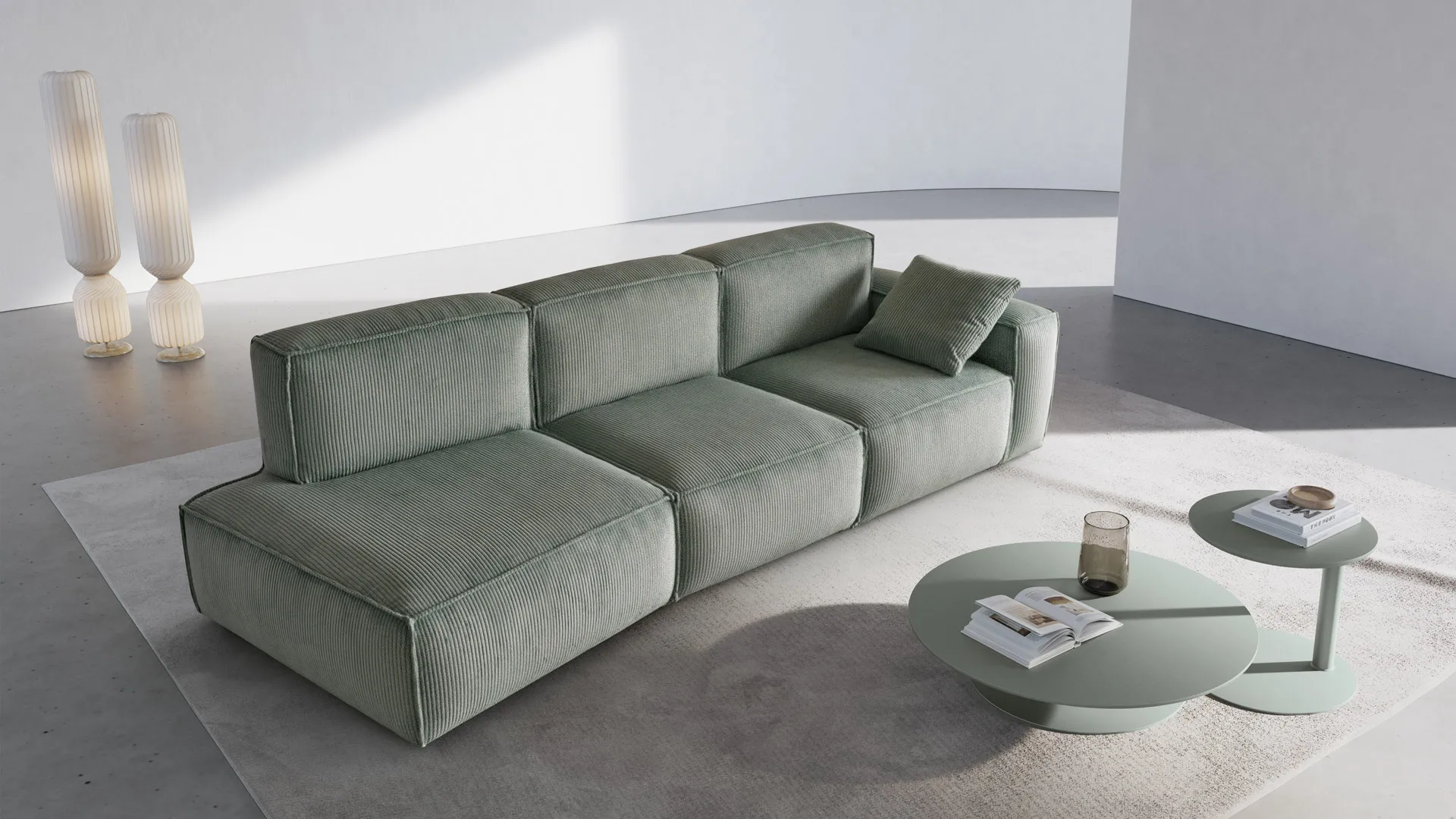 Divano Keira Aerre Divani verde salvia ad angolo con tavolini rotondi