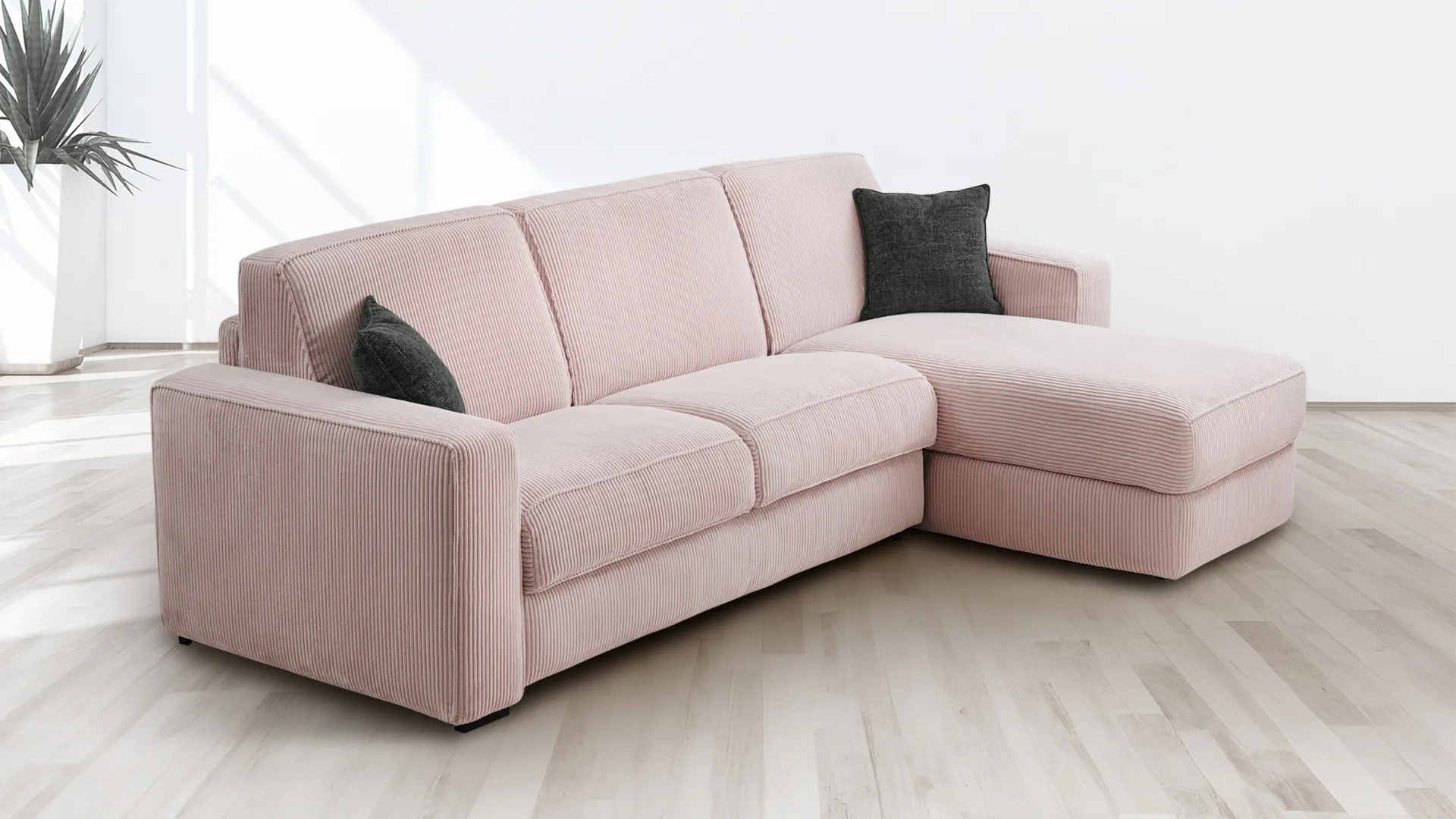 Divano letto Melita Aerre Divani rosa con chaise longue su pavimento chiaro