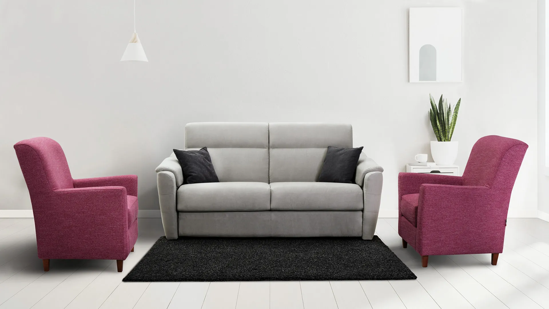 Divano Elettra Jazz Aerre Divani grigio chiaro fra due poltrone fucsia