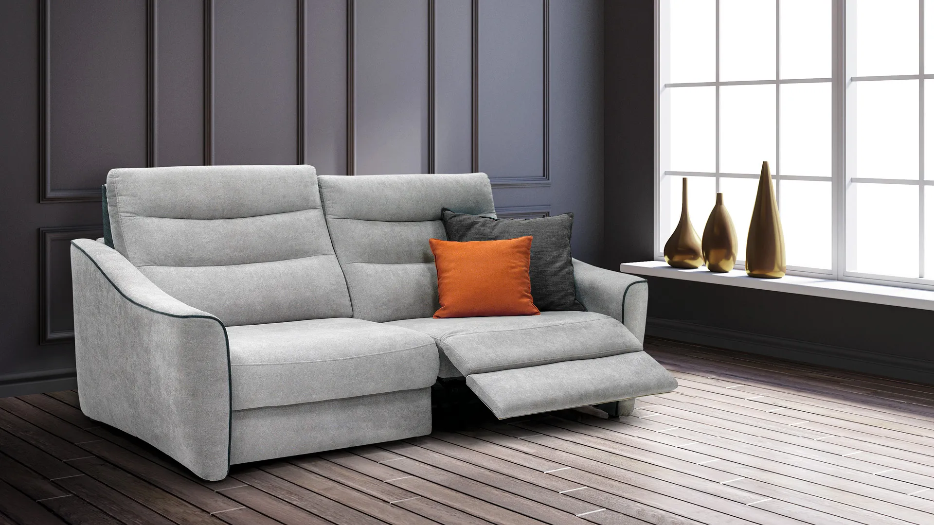 Divano relax Nicole Aerre Divani grigio chiaro con bordino scuro e cuscino arancio