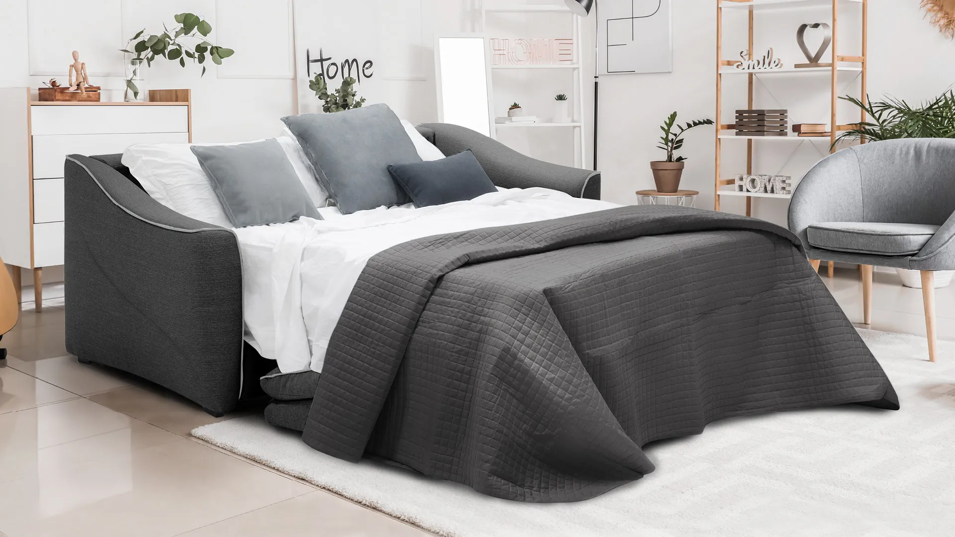 Divano letto Nicole Aerre Divani grigio scuro aperto con lenzuola grigie