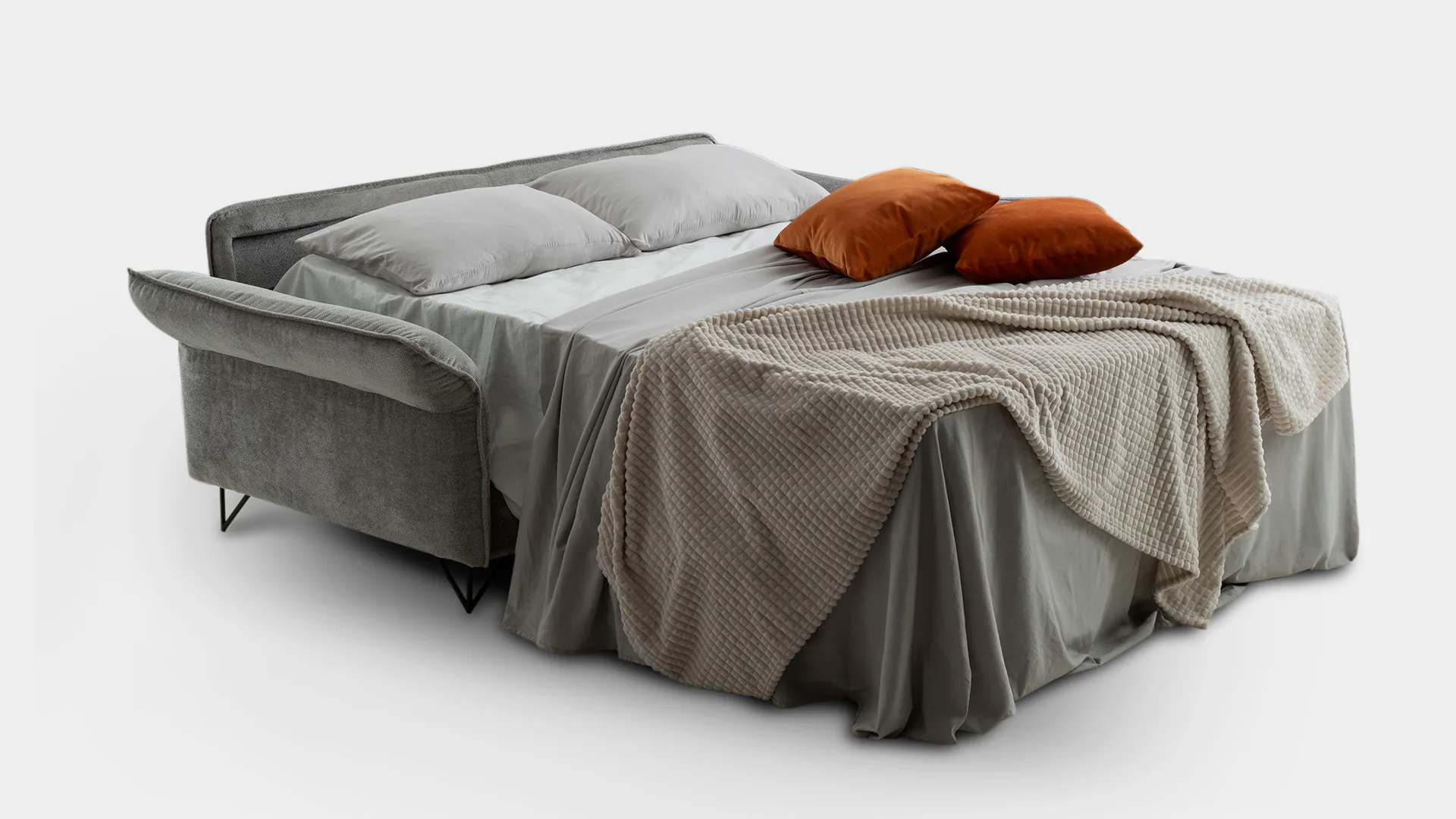 Divano letto Giselle Aerre Divani aperto con lenzuola grigie e plaid