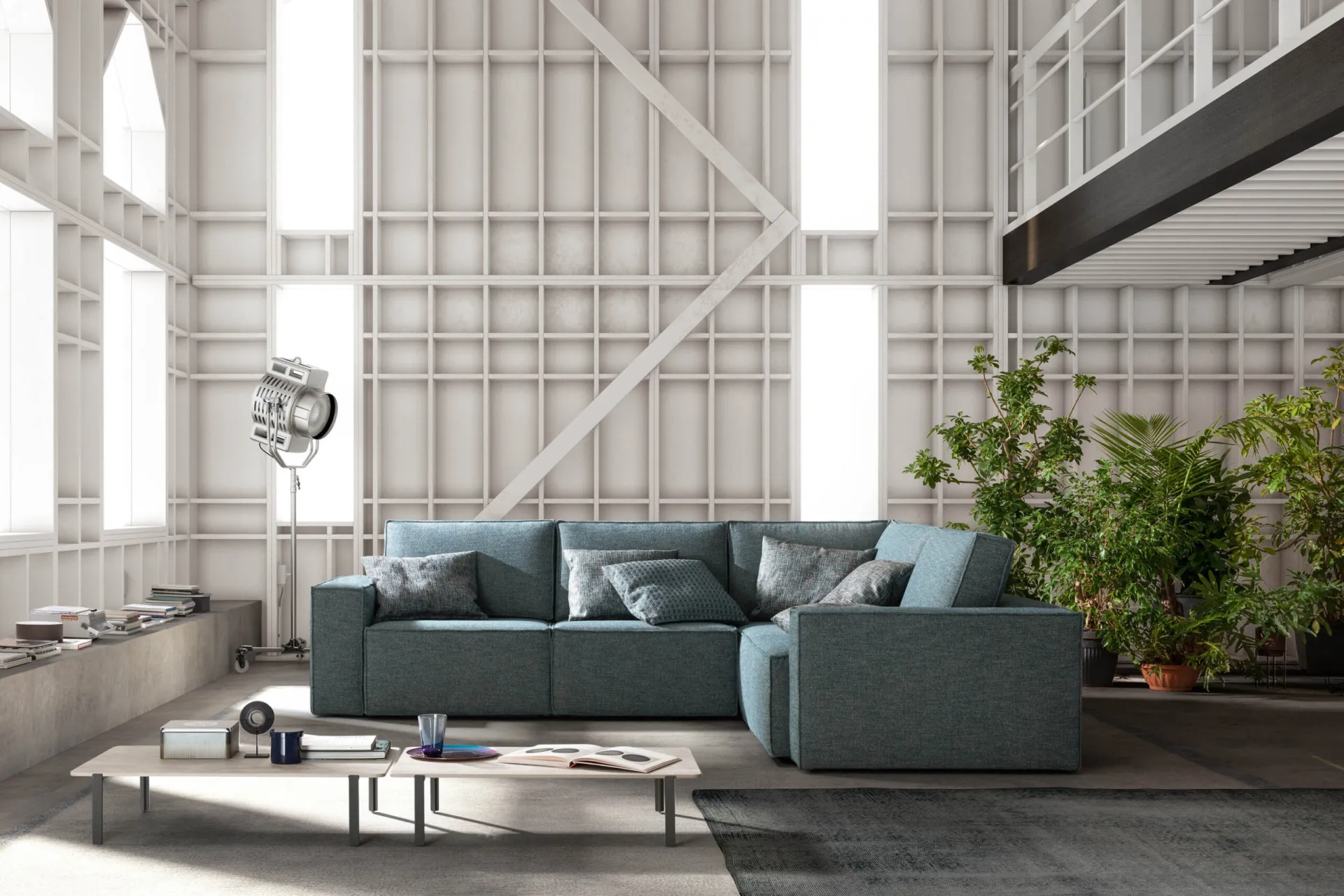 Divano Mono Samoa angolare color ottanio in un loft industriale bianco