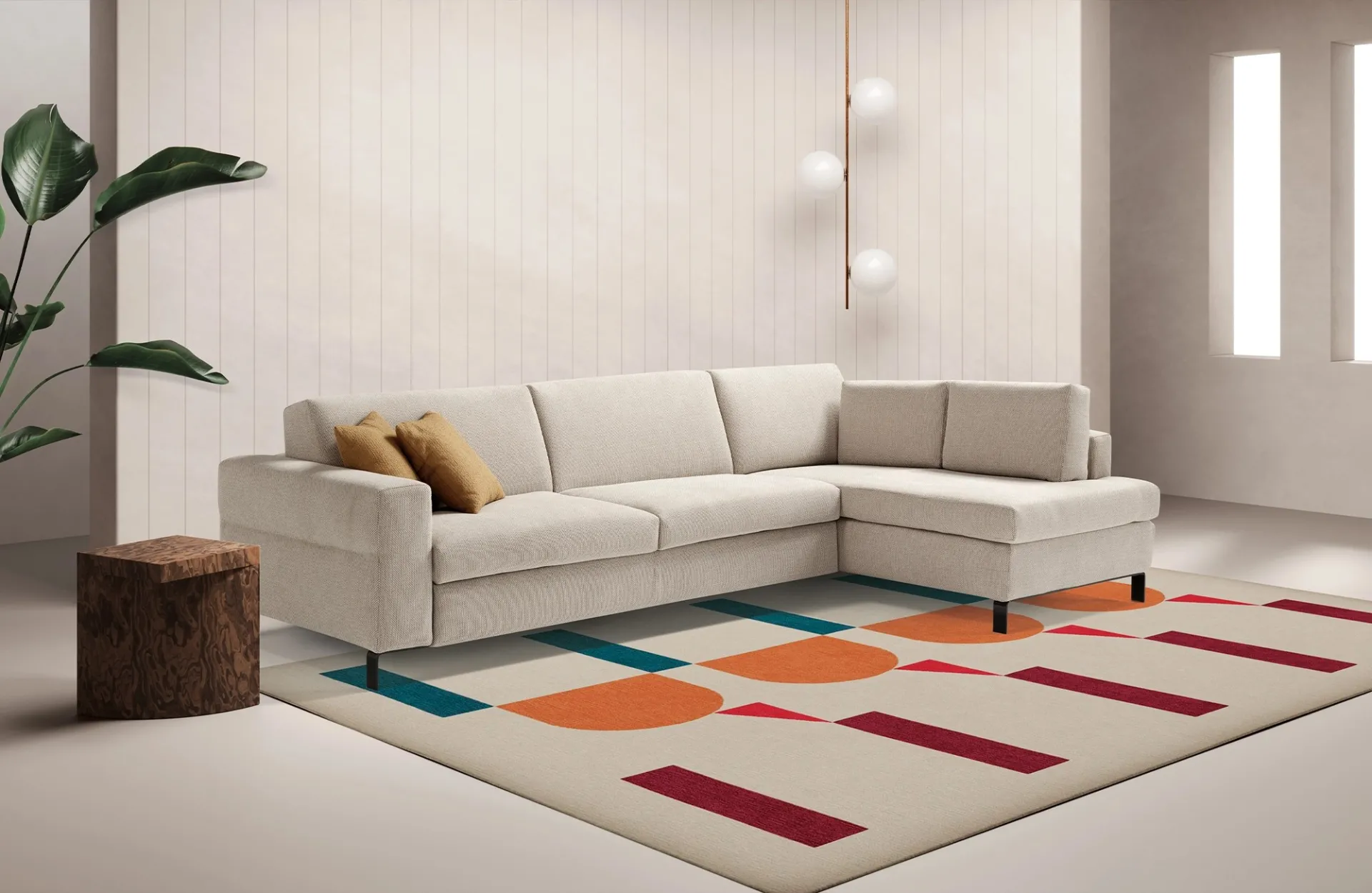Divano letto Life Dienne beige con terminale ad angolo su un tappeto geometrico colorato