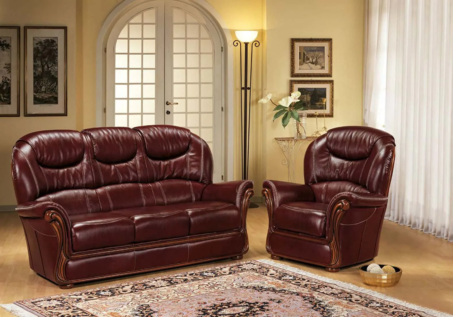 Divano classico Laura Rosini in pelle bordeaux con poltrona