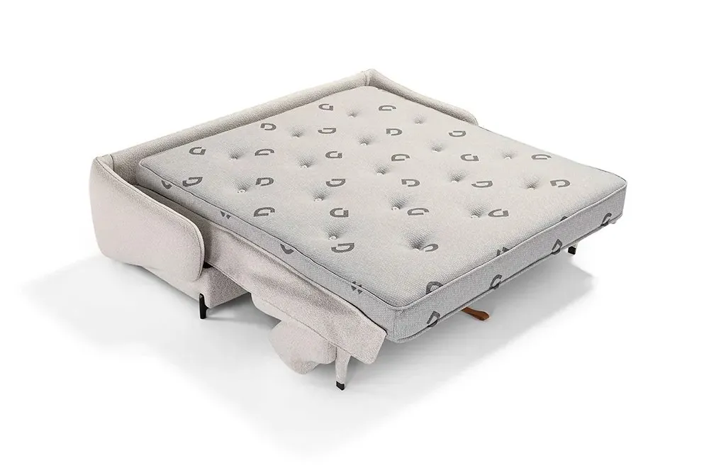 Materasso Premium Box Dienne su divano letto aperto con rivestimento in tessuto chiaro