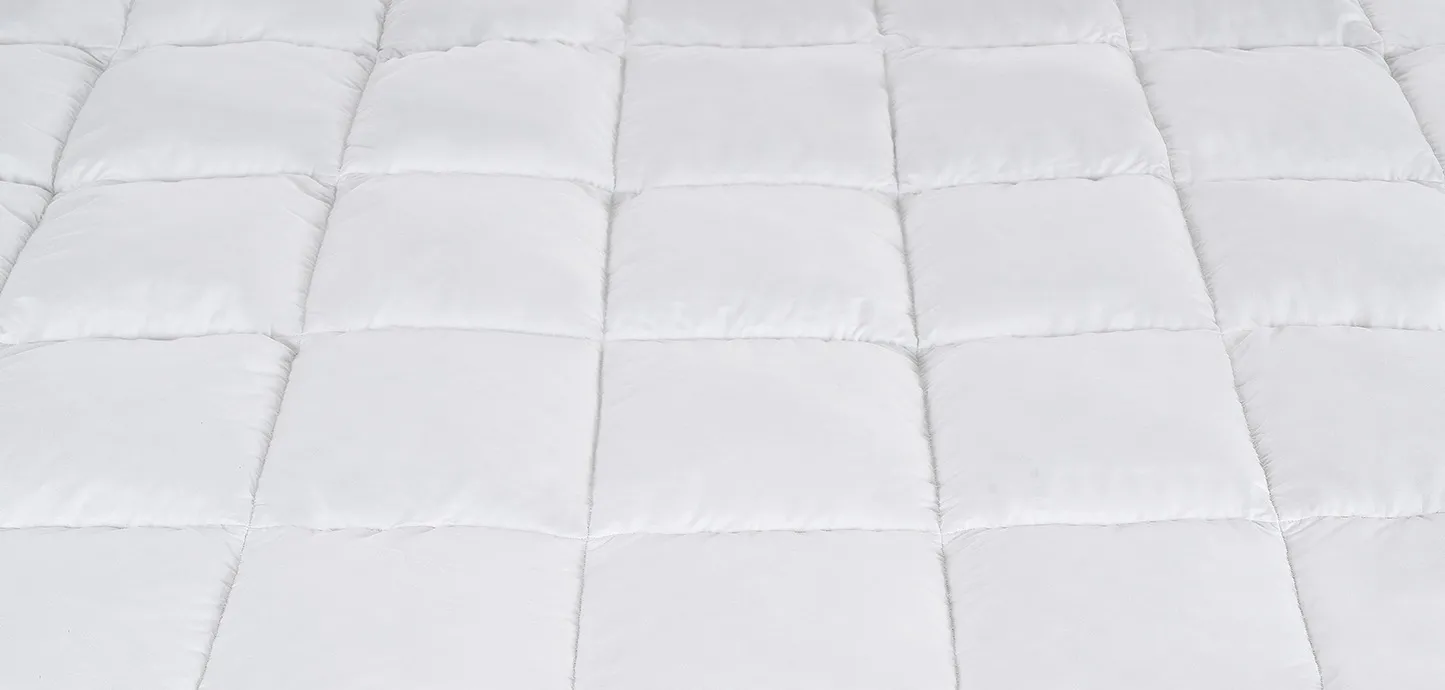 Trapuntatura a grandi riquadri del Topper Piuma Magniflex in cotone