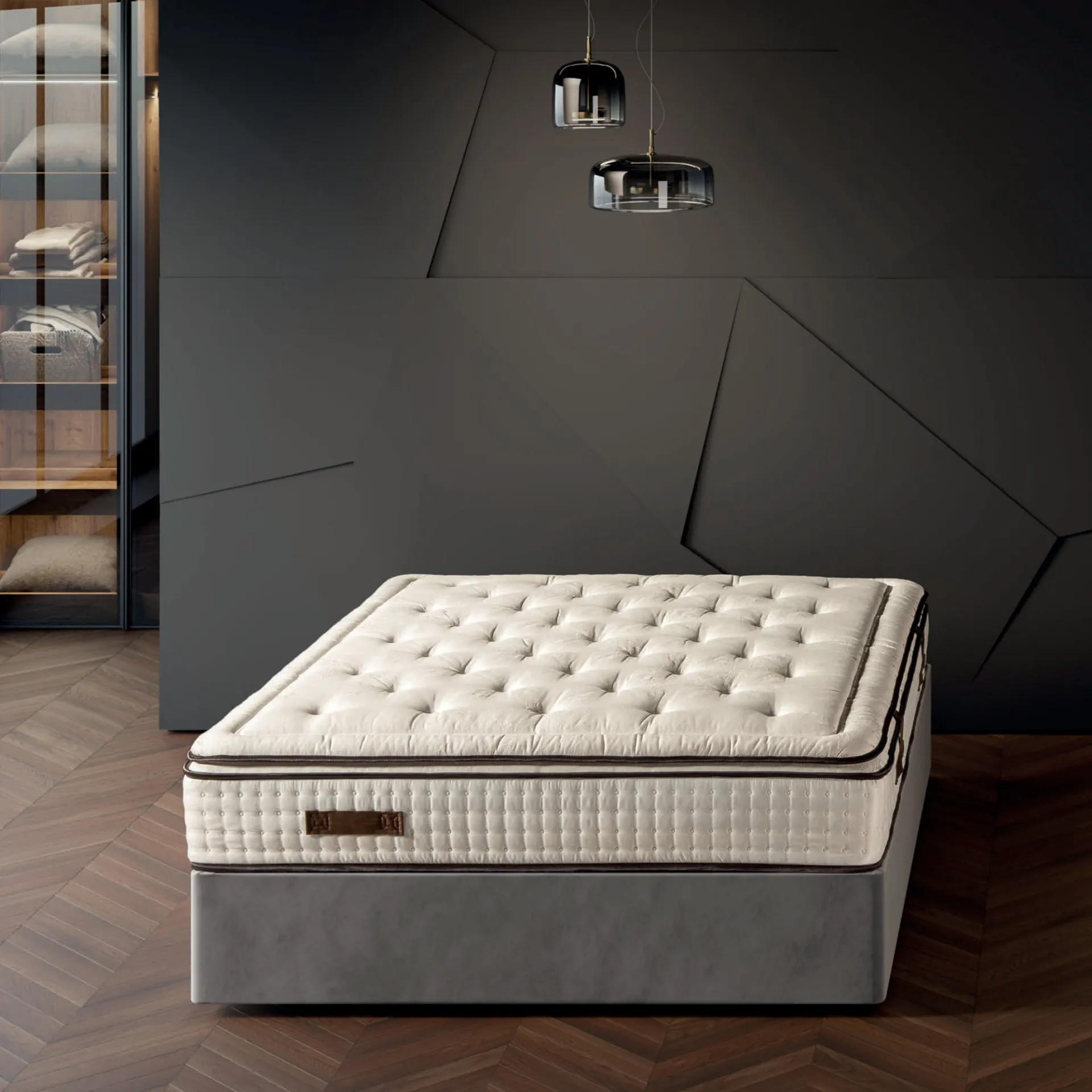 Materasso Elite 1600 Manifatture dell'Adriatico su sommier grigio in una camera con cabina armadio