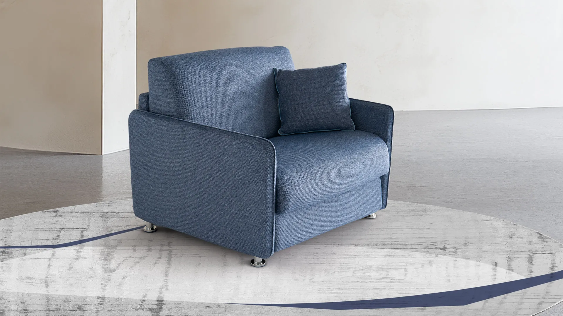 Poltrona letto Tilly Aerre Divani blu con cuscino su tappeto rotondo