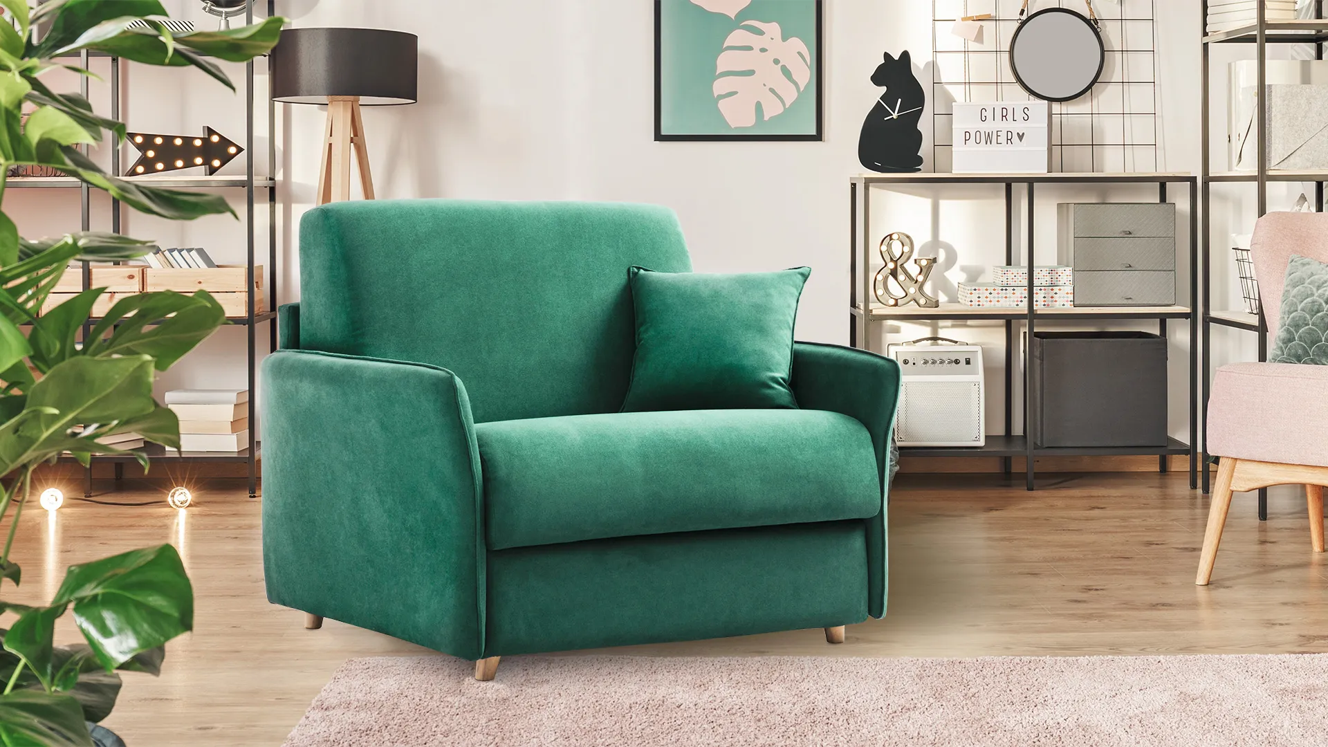 Poltrona letto Zara Basic Aerre Divani verde smeraldo in un soggiorno con libreria