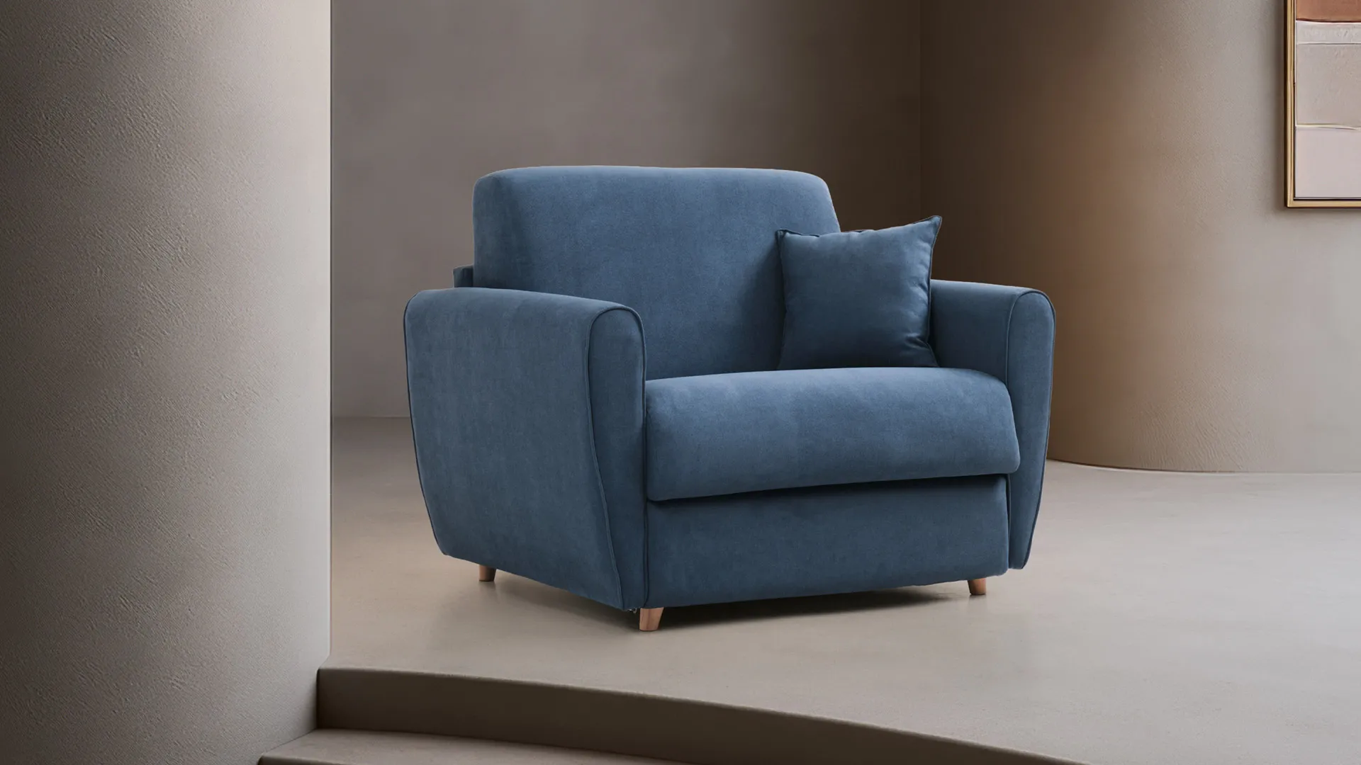 Poltrona letto Gina Basic Aerre Divani blu con cuscino in una stanza dai toni caldi