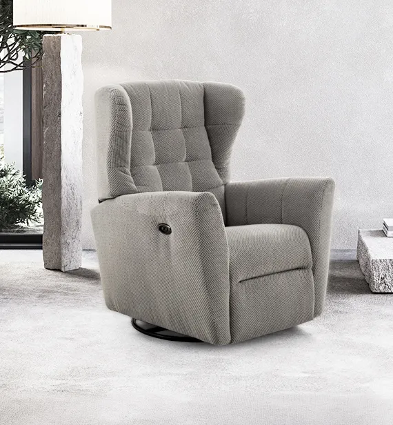 Poltrona relax Coco Aerre Divani grigio tortora a orecchioni in un ambiente con colonne