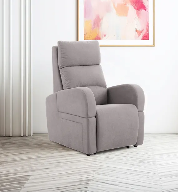 Poltrona relax Teresa Aerre Divani grigio talpa accanto a un quadro colorato