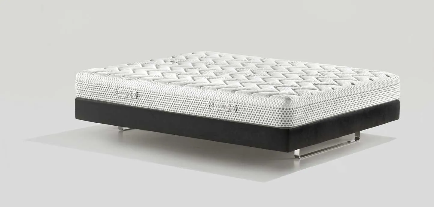 Materasso Massaggio Light Magniflex bianco di tre quarti su base scura