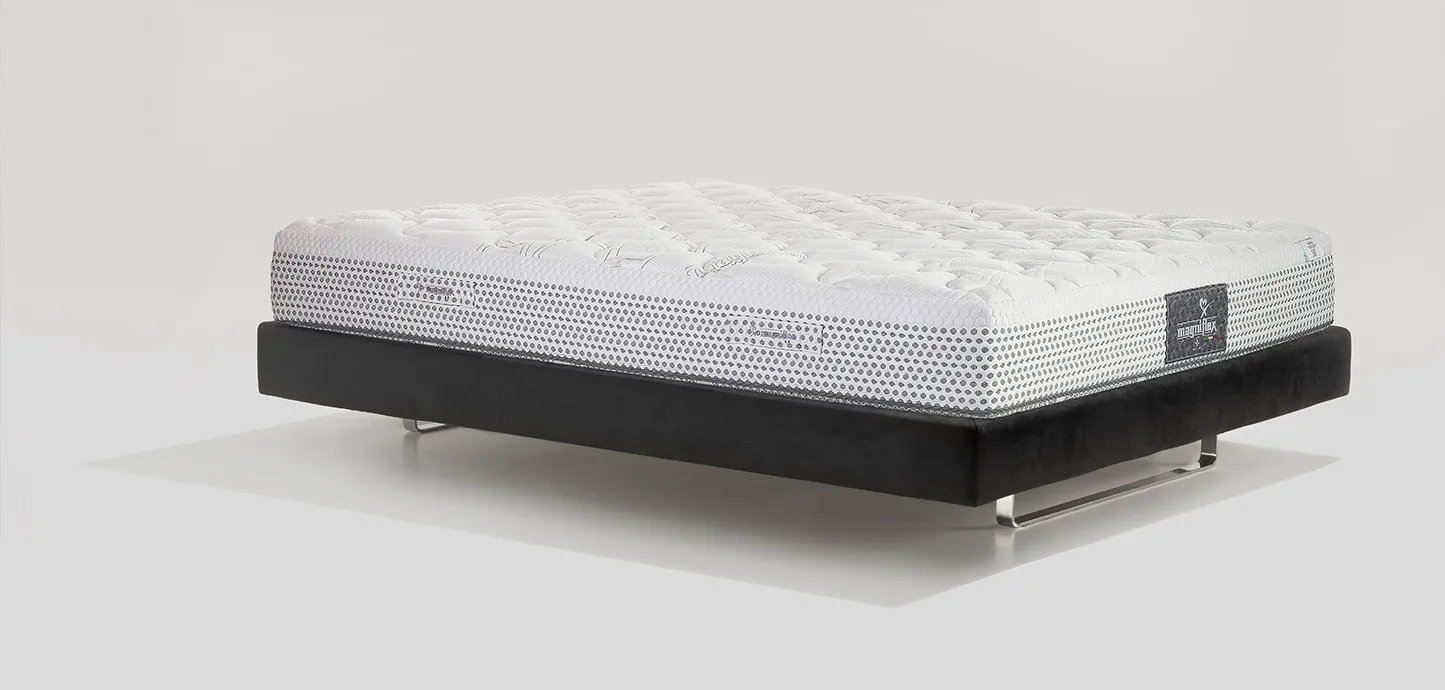 Materasso Massaggio Excellence Magniflex di tre quarti, piano bianco e fascia grigio perla