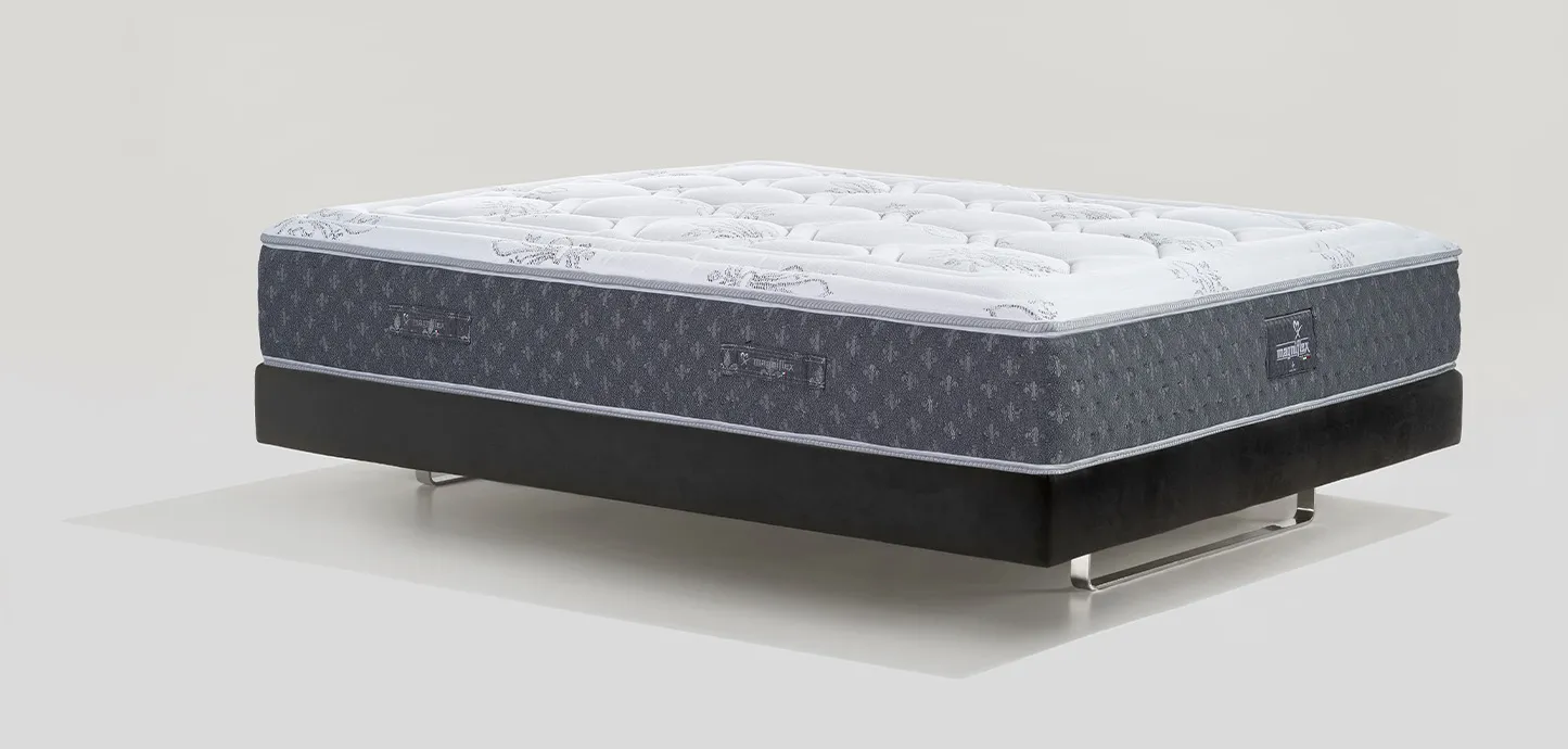 Materasso a molle Sonno Infinity Cool Magniflex con fascia scura a gigli e topper bianco
