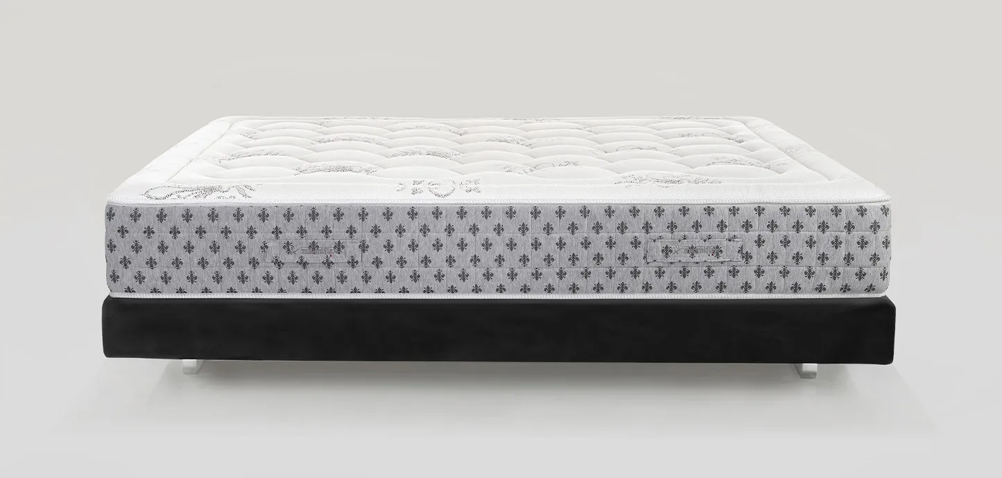 Materasso a molle Sonno Pure Magniflex visto di lato su base letto nera