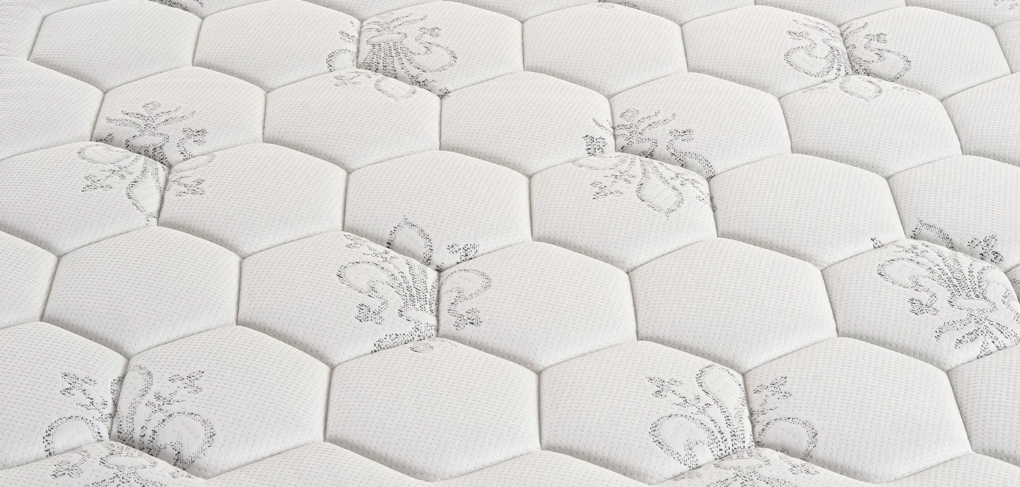 Dettaglio della trapuntatura a esagoni del materasso a molle Sonno Pure Magniflex