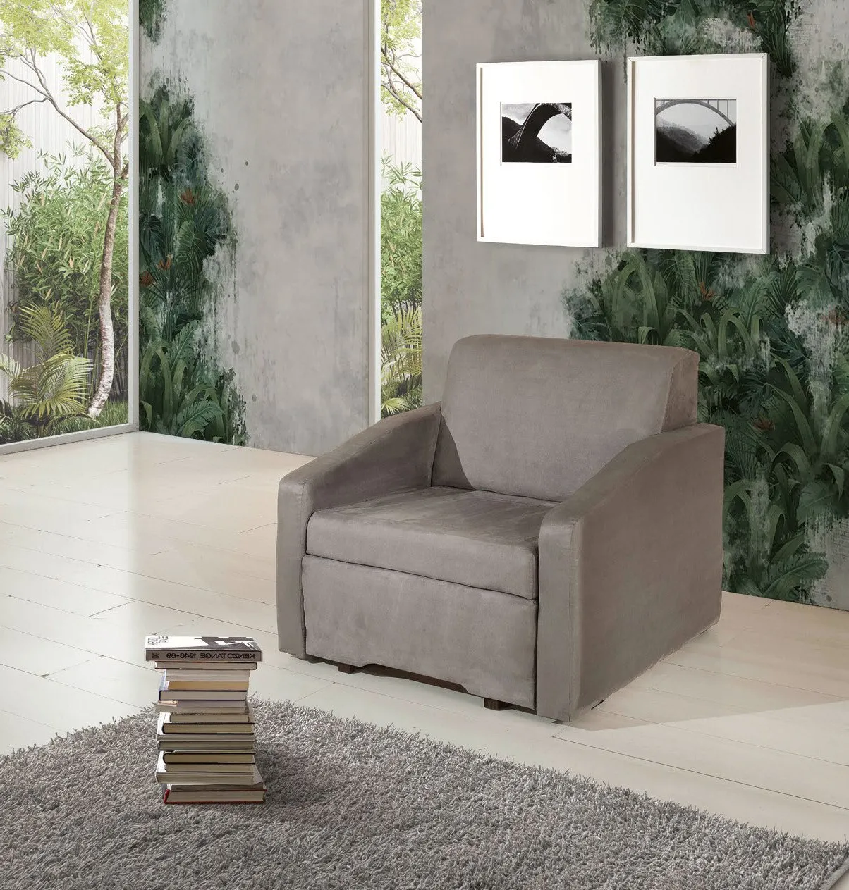 Poltrona letto Urban Style Imba in tessuto grigio tortora con libri accanto